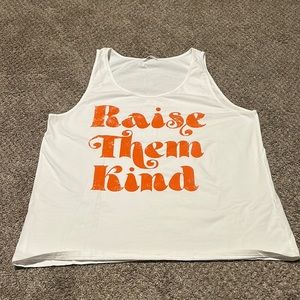 White tank with “raise them kind” in orange